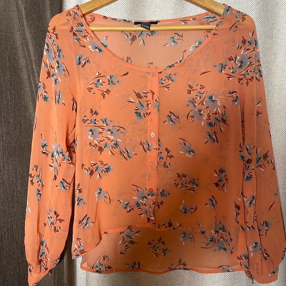 Orange floral print top in size Small only used once